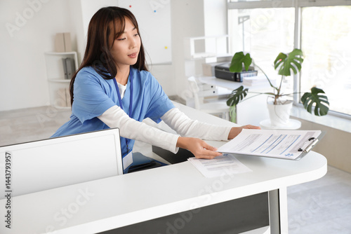Female Asian medical intern...