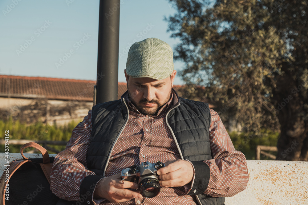Photographer Rewatching The Photos Made During The Day