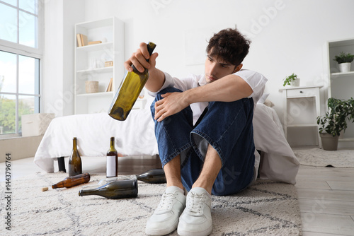 Drunk young man at home. Al...