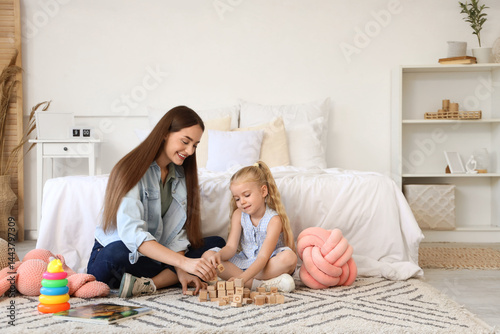 Nanny and cute little girl ...