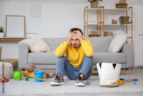 Stressed young father clean...