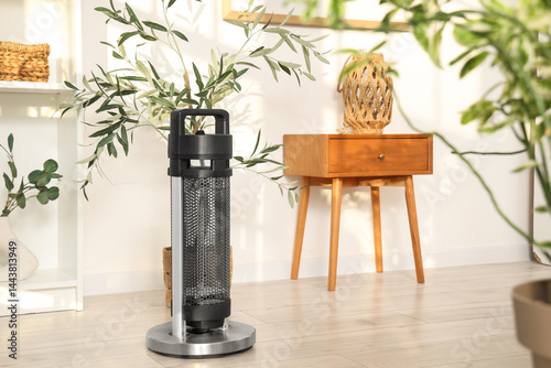 Electric heater on floor in...