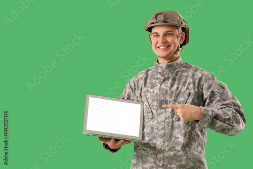 Young soldier pointing at b...