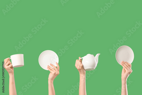 Hands holding white ceramic...