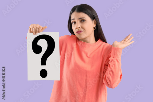 Obraz na płótnie Young woman with paper question mark shrugging on lilac background w salonie