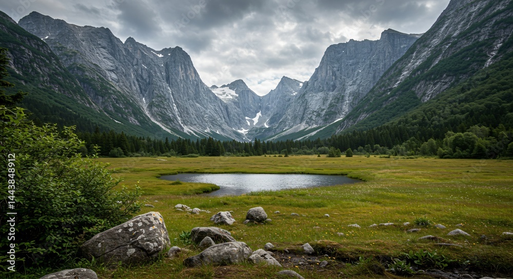 Naklejka premium a mountain range with a lake and mountains in the background