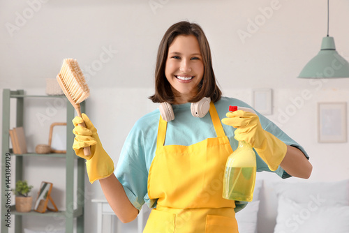 Female janitor with cleanin...