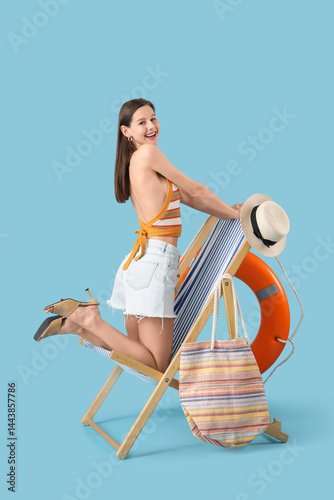 Happy young woman with deck...