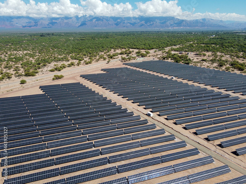 The dawn light illuminates the extensive solar panel fields in Tinogasta, Catamarca, Argentina. A symbol of Argentina's commitment to clean energy and sustainable development.
