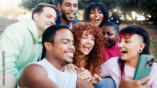 Diverse friends have fun on park city in summer vacation. Group of people smile at camera for selfie on travel vacation
