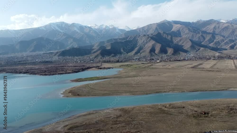 reservoirs and lakes against the backdrop of mountains and clouds in Kyrgyzstan on Lake Issu-Kul reservoirs and lakes against the backdrop of mountains and clouds in Kyrgyzstan on Lake Issu-Kul