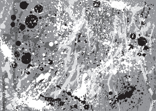 灰色ベースに白や黒のインクの飛沫をかけた背景