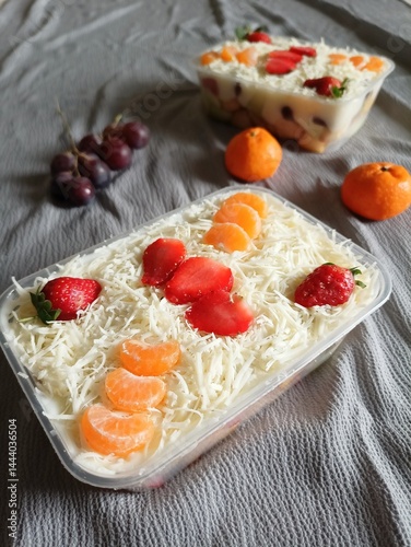 Refreshing fruit salads served in plastic container photo