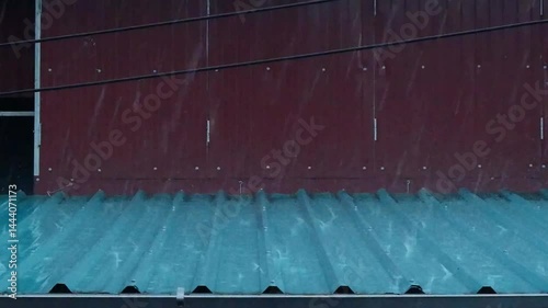 Rain falling on the tin roof.