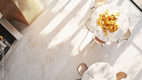 Modern, airy restaurant interior with round tables and decorative golden accents