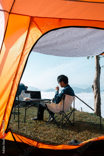 Wallpaper Mural Remote work technology online close up communication smart phone laptop telephone digital travel brown nature sunlight camp beverage morning sit drink coffee tent orange outlying concept background. Torontodigital.ca