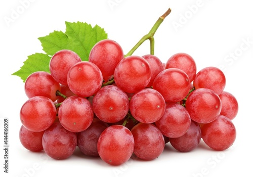 A bunch of red grapes with green leaves attached to the stem isolated on a white background close up view
