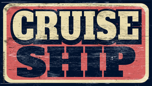 Aged and worn cruise ship sign on wood