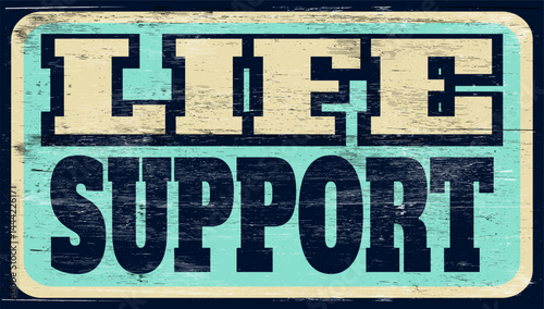 Aged retro life support sign on wood