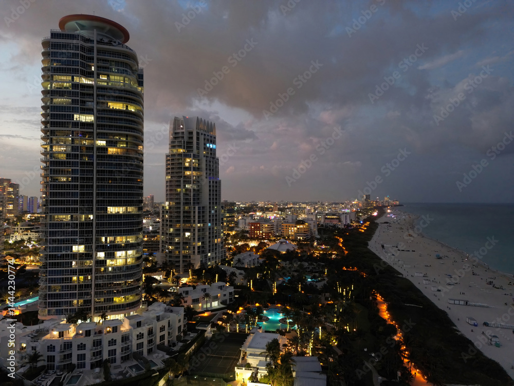 Cityscape of downtown Miami at night light. Tropical paradise in South Beach. Midnight city lights in Miami. Waterfront view of Miami skyline. Aerial shot of Miami at sunrise. Neon Art Deco. Ocean
