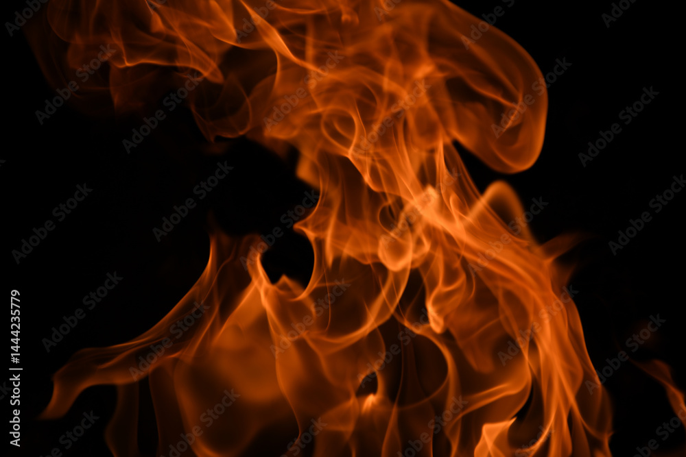 Texture of fire on a black background. Abstract fire flame background, large burning fire.