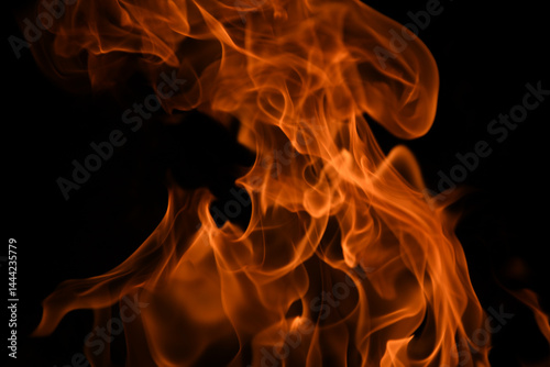 Texture of fire on a black background. Abstract fire flame background, large burning fire.