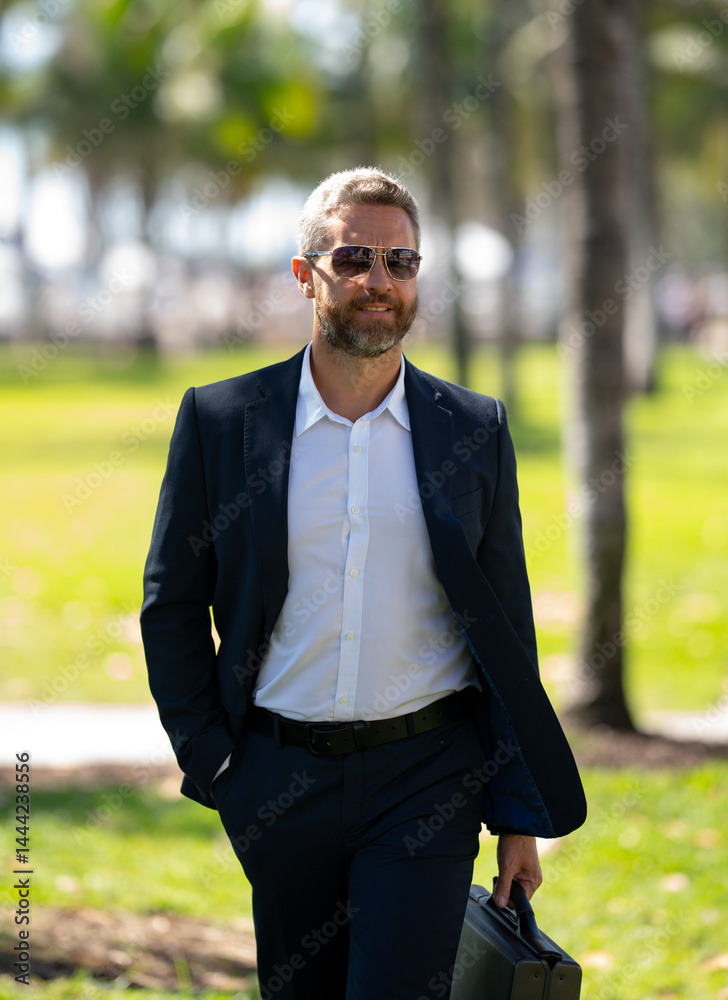 Hot business. Summer business. Business man on palm trees. Businessman in summer. Mature stylish freelancer outdoors portrait. Handsome business man in casual wear on vacation.