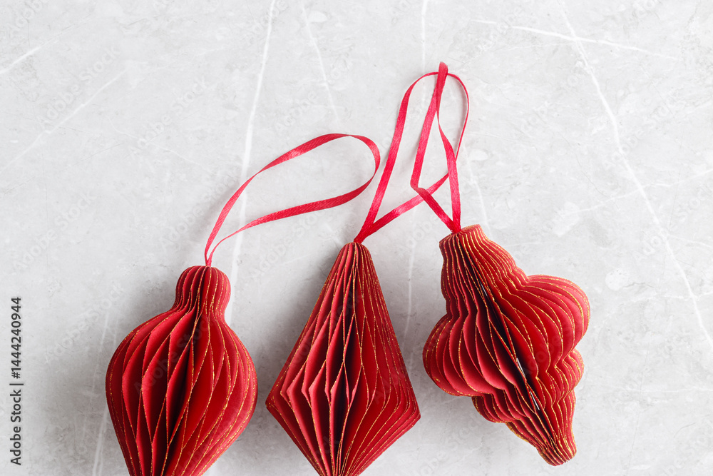 Red Christmas Paper flashlights different shapes, Christmas tree stylish ornaments for winter holidays, minimal style New Year flat lay pattern with copy space, greetings card or holiday background