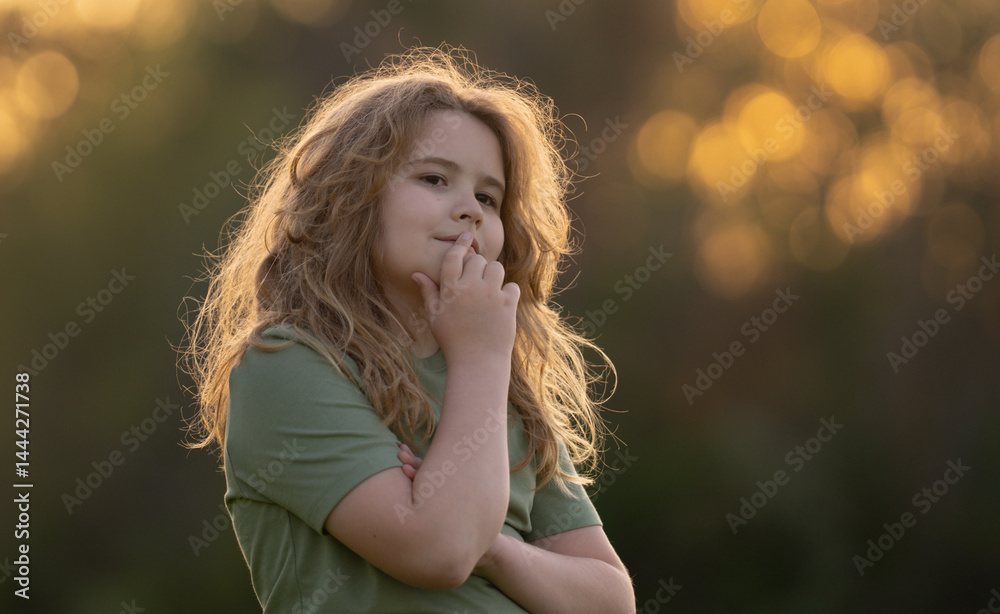 Kid looking away and thinking. Child dreamer thinking with a doubtful look. Portrait of a child thinking deeply. Dreamy teen child lost in thinking. Clever boy with thoughtful face. Daydreaming kid.