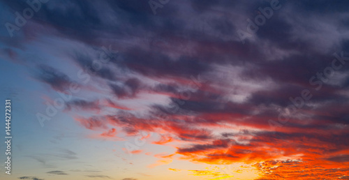 Obraz na płótnie Sky at sunset. Sunrise over horizon. Sunset through clouds on sky. Twilight sky with sunset colors. Peaceful dawn with soft light. Dramatic dusk sunset with clouds. Sunshine in clear sky. w salonie