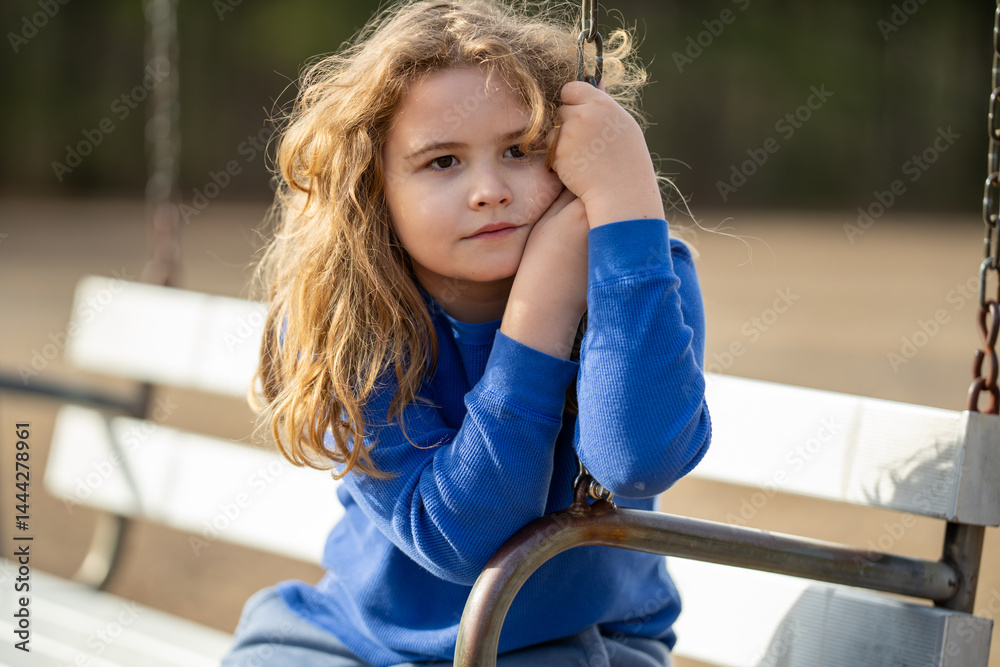 Kid in a daydream. Carefree childhood in nature. Dreamy kid. Thoughtful child. Little kid dreamer. Young mind full of imagination. Blonde kid thinking. Kids freedom. Calm and peaceful childhood.