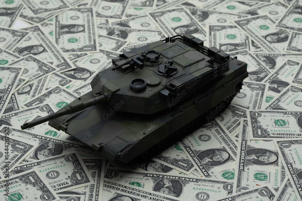 War and money concept. Financial support war in Ukraine. Tank in military scene. Defense strategy. Money funding the attack. Financing war. Money becomes a weapon of war. Dollar as a symbol of power.