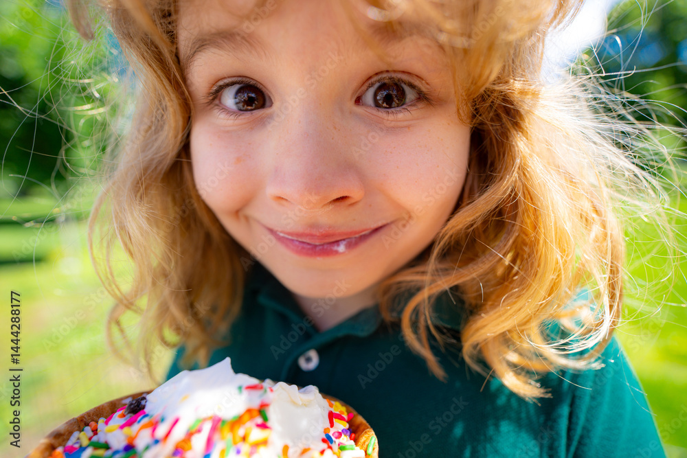 Child eating ice cream. Summer kids funny face. Kid licking icecream cone. Little funny boy with ice-cream. Cute boy enjoying ice cream. Kids fun face. Child with ice cream close-up.