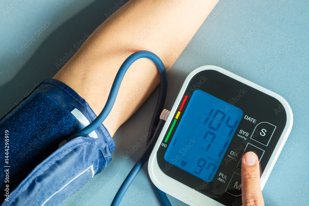 Man check blood pressure monitor and heart rate monitor with digital pressure gauge. Health care and Medical concept