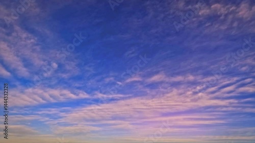 sky timelapse - golden sundown scene with small clouds - loop video