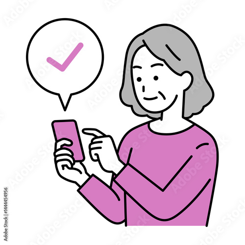 スマートフォンでチェックする年配の女性