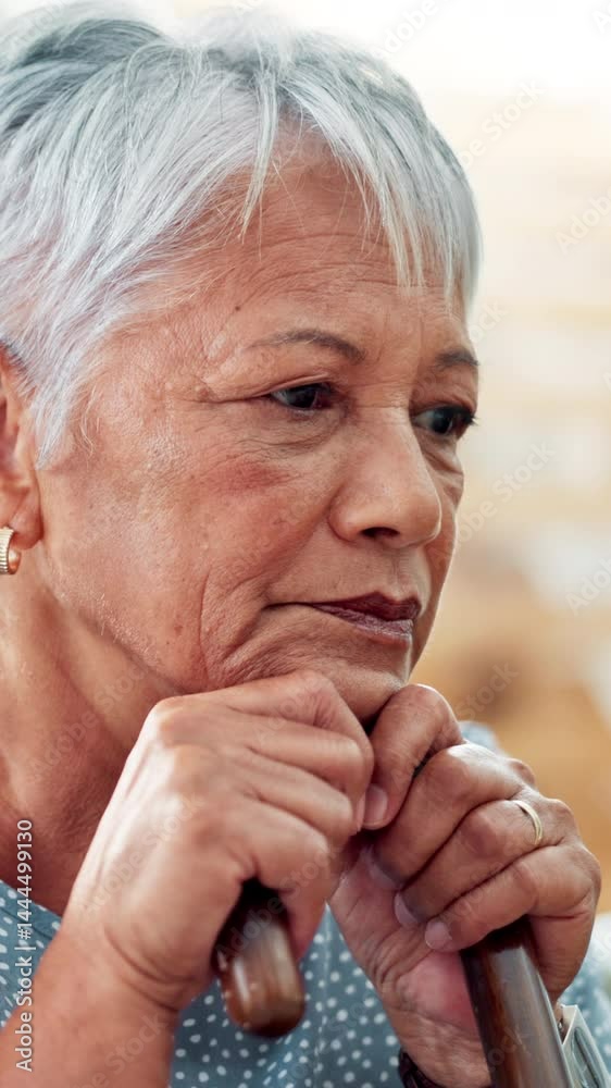 Cane, sad and old woman with thinking in nursing home for memory, nostalgia and lonely in retirement. Face, walking stick and elderly person with depression for grief, remember and mourning widow