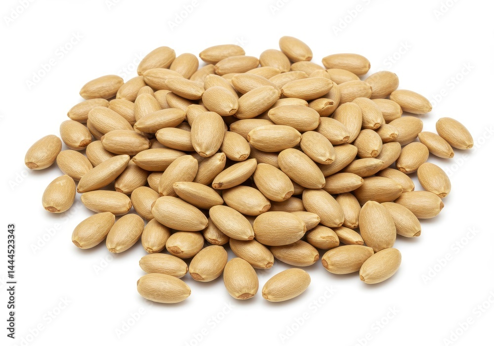 A pile of blanched peanuts scattered on a white surface in a close up studio shot of the nuts A pile of blanched peanuts scattered on a white surface in a close up studio shot of the nuts