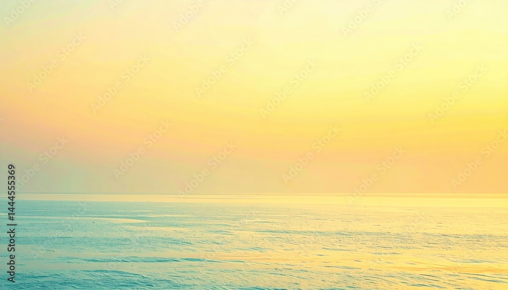 Naklejka premium Tranquil sunrise over calm ocean waters coastal landscape serene environment wide-angle view natural beauty
