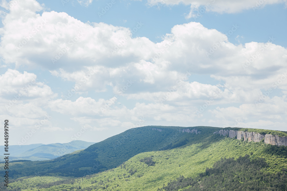 Naklejka premium Beautiful landscape on green forest and blue sky from the top of the mountain