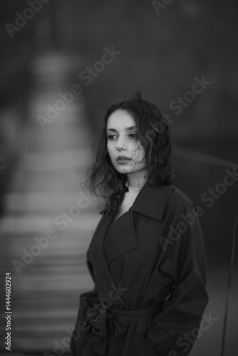Obraz na płótnie beautiful brunette european girl in blue trench coat at nature. Young lady with beautiful face. w salonie