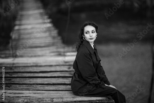 Obraz na płótnie beautiful brunette european girl in blue trench coat at nature. Young lady with beautiful face. w salonie