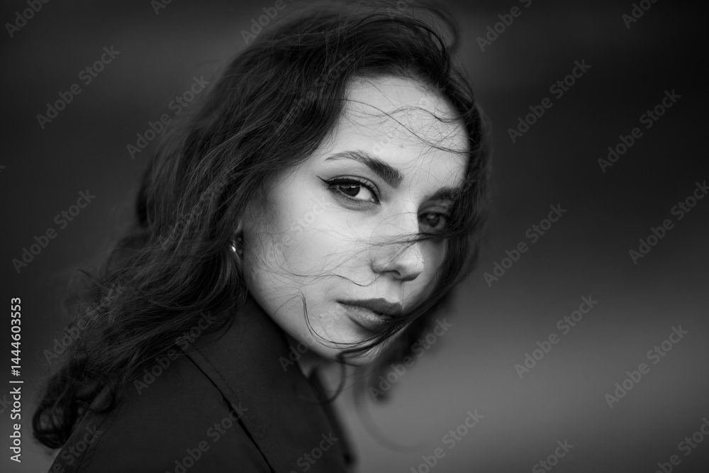 beautiful brunette european girl in blue trench coat at nature. Young lady with beautiful face.