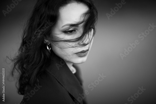 Obraz na płótnie beautiful brunette european girl in blue trench coat at nature. Young lady with beautiful face. w salonie