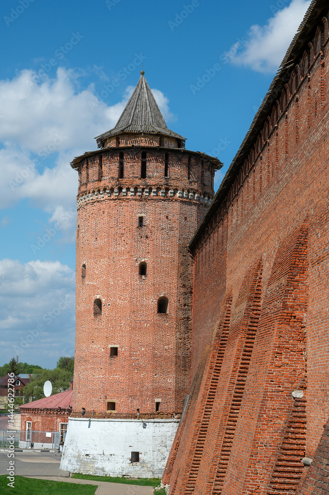 Fototapeta premium Kolomna, Marinkina Tower of the Kolomna Kremlin. A fragment of the ancient fortress wall and the Kolomna Round Naugol Tower. Kolomna Kremlin
