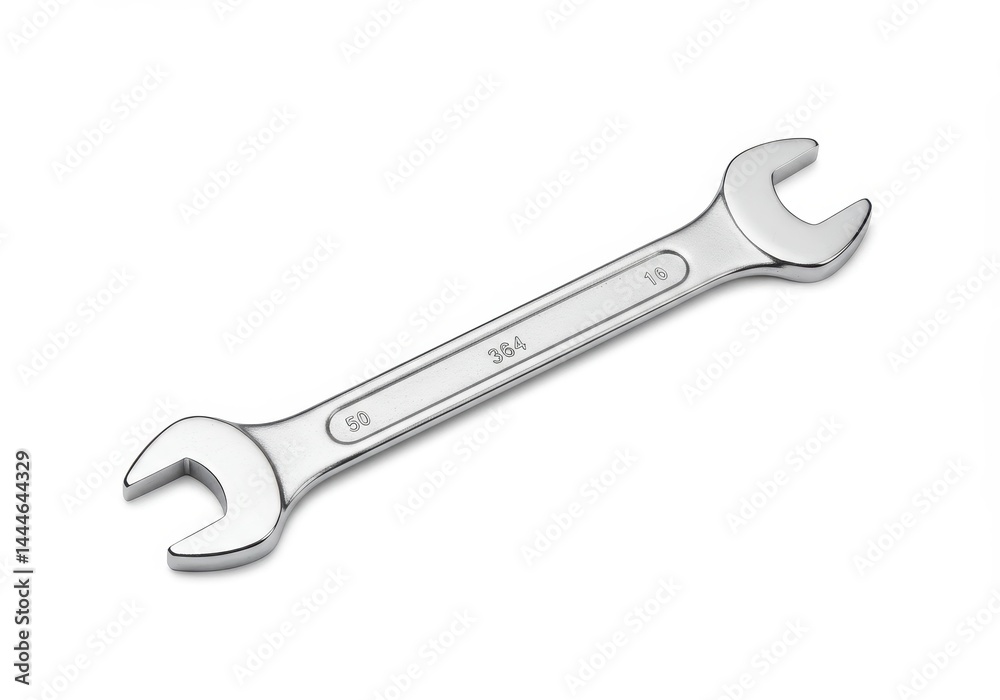 A chrome wrench with open ends lying diagonally on a white background in a studio setting view A chrome wrench with open ends lying diagonally on a white background in a studio setting view
