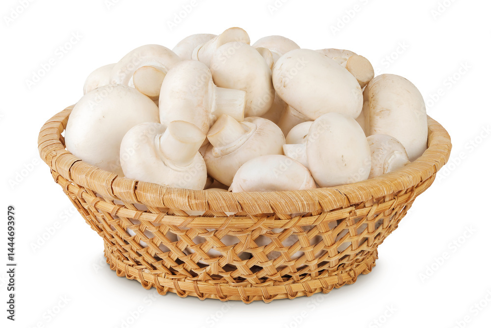 Fresh mushroom champignon in a wicker basket isolated on white background Fresh mushroom champignon in a wicker basket isolated on white background