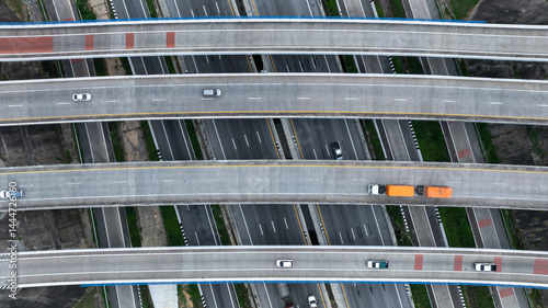 Obraz na płótnie Aerial view highway intersection road, Business logistic transport infrastructure logistic transport, Highway road traffic important infrastructure business logistic import export cargo industry. w salonie