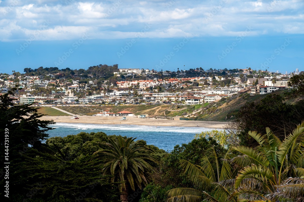 Inland angle of coastal section of the South Bay, Southern California with dramatic blue and cloudy sky