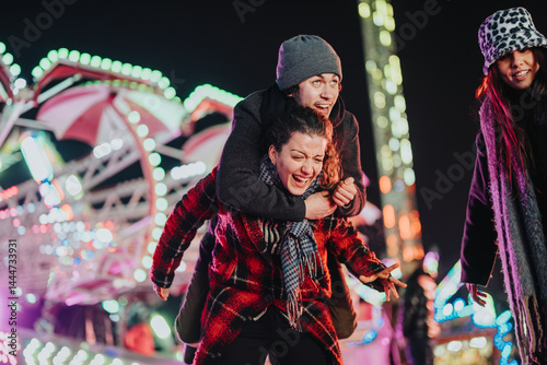 A cheerful group of friends having fun together during the evening under vibrant carnival lights. The highlighted setting conveys happiness, fun-filled moments, and the strong bond of friendship.
